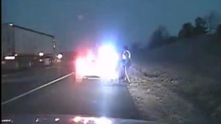 Airborne Truck Narrowly Misses Police Officers Along Iowa Highway VIDEO