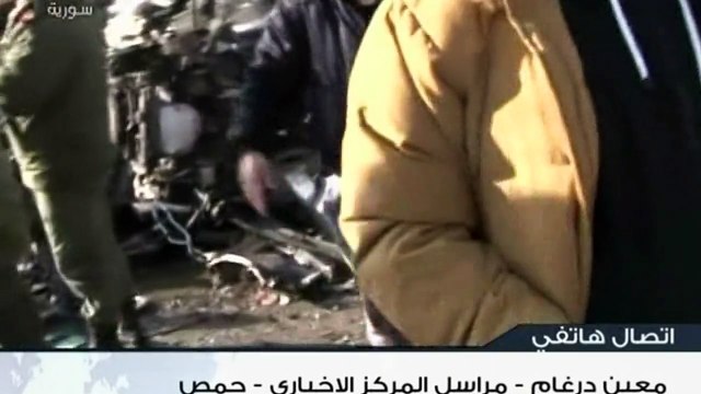 Bombs kill 22 at army checkpoint in Syria's Homs: state TV