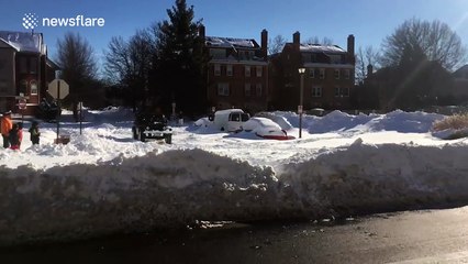 Snowboarding on the streets of Washington DC on the back of a Jeep