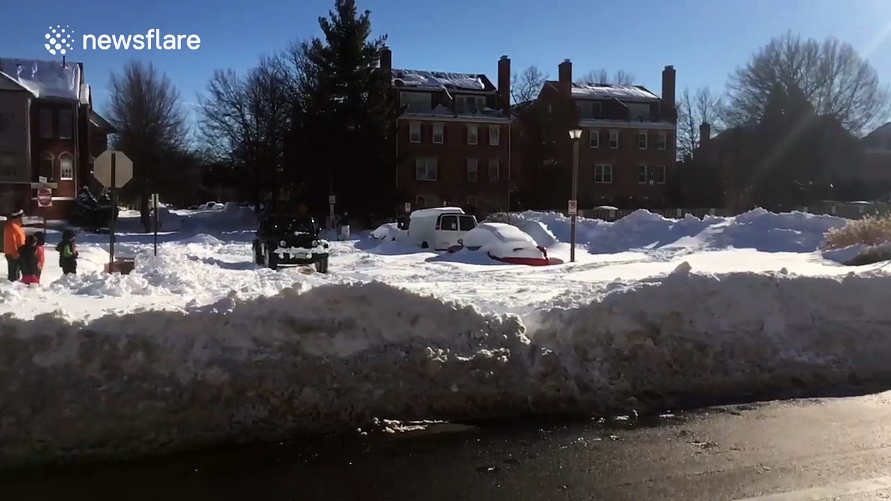 Snowboarding on the streets of Washington DC on the back of a Jeep