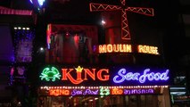 European girl dancing at the moulin rouge walking street