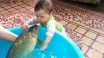 CHECK IT CUTE BABY KISS WITH FISH
