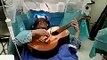 Chinese musician plays guitar in brain surgery