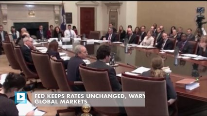Fed keeps rates unchanged, wary eye on global markets