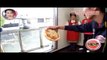 Throwing a PIZZA into a microwave across the street. Genius !