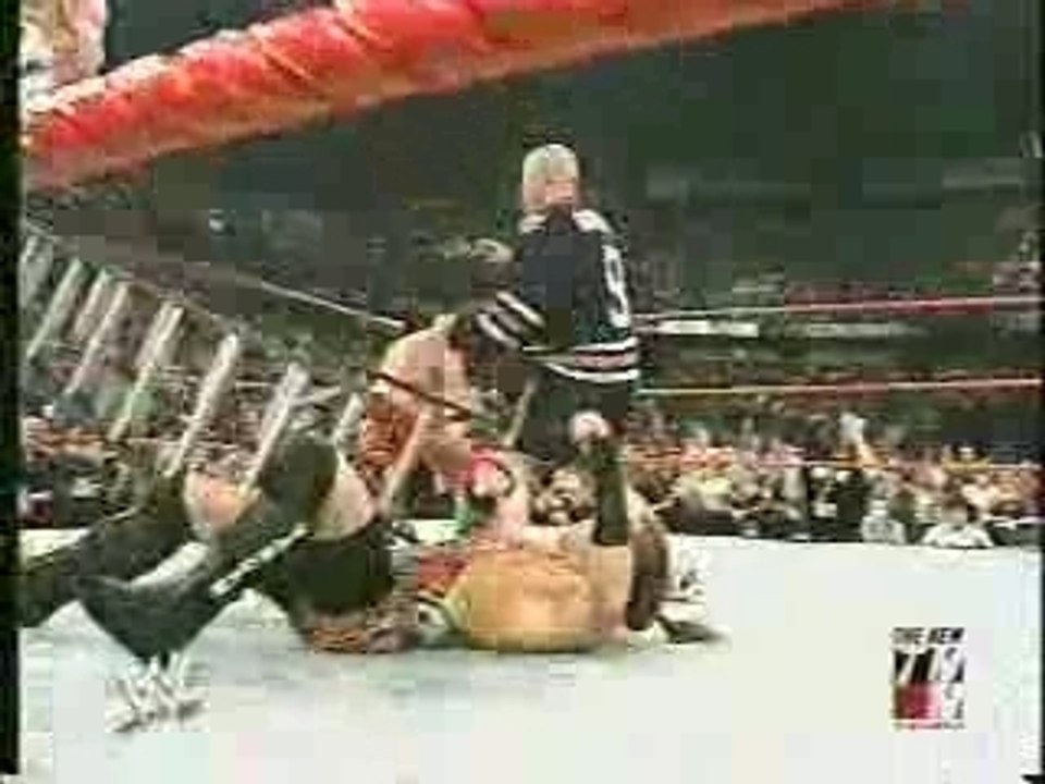A Fan attacks Eddie Guerrero during his match