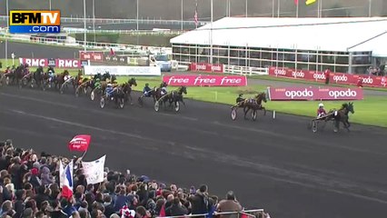 Christophe Delay, casaque rouge et blanche, dispute le Prix d'Amérique