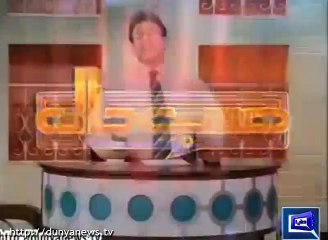 Azizi as Tariq Aziz in comical fight with another news anchor