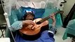 Chinese musician plays guitar in brain surgery