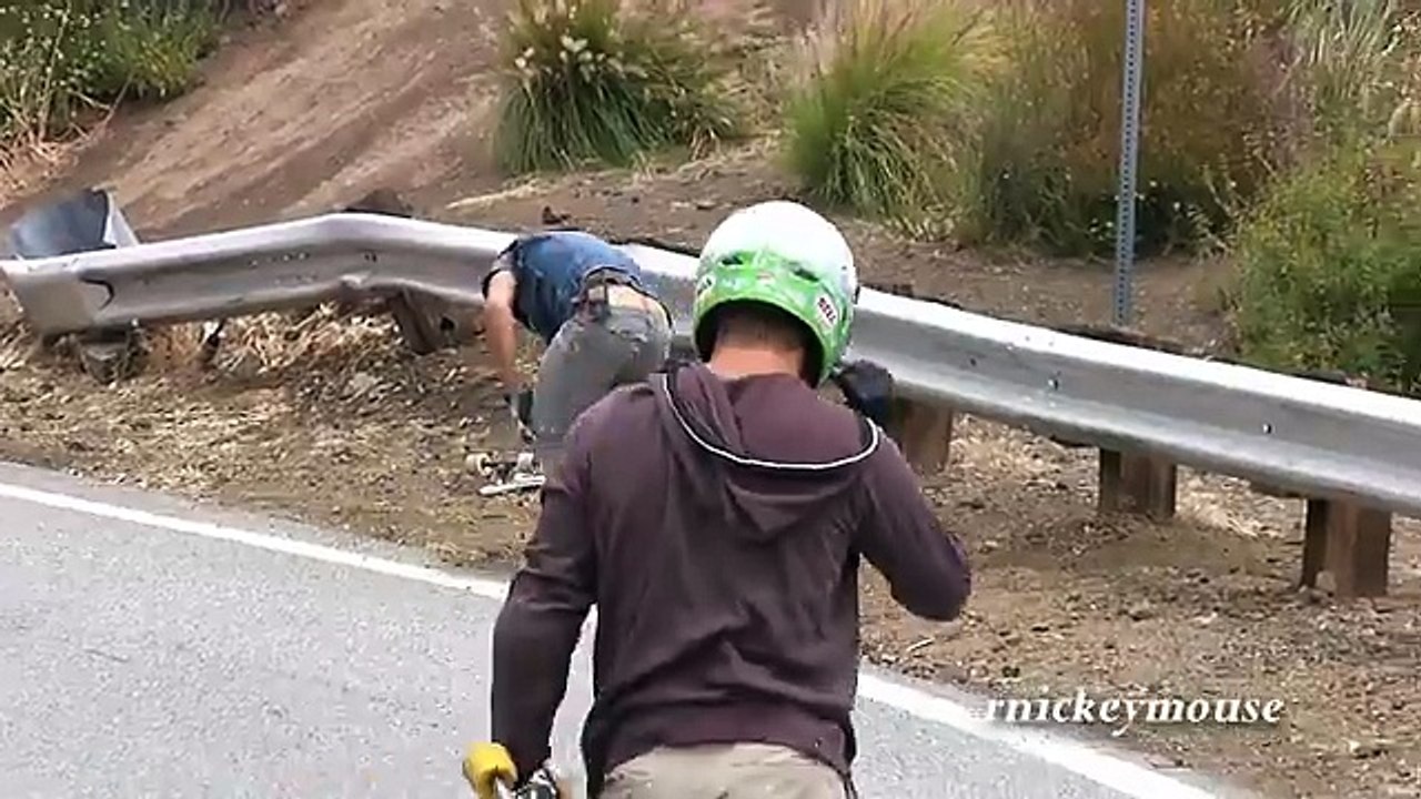 Longboarder Crashes into Guardrail