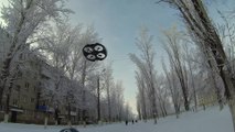 Snowboarding toddler uses flying drone to move around