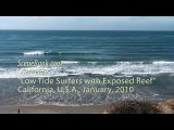 Low Tide Surfers with visible Reef