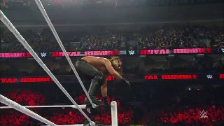 Seth Rollins hits a flying elbow drop onto the announce table- Slow Motion Replay from Royal Rumble 2015