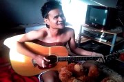 The man sing and play guitar thailand