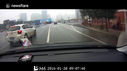 Taxi hits car, sending it smashing into a lorry