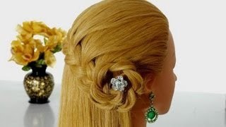 Romantic hairstyle for long hair with braided flower.