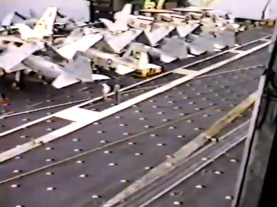 Helicopter dropping of 3 greased pigs on a aircraft carrier!