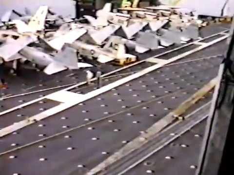 Helicopter dropping of 3 greased pigs on a aircraft carrier!