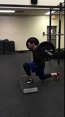 Reverse lunge with band at Impact Fitness