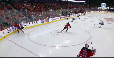 Dennis Wideman cross checks linesman Don Henderson