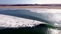 Stealth Shark Swims beneath Surfers - Drone Footage