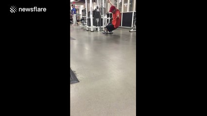 Man's unorthodox use of a cable machine at the gym