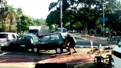 Buff Biker Lifts Car Off of Bike Path