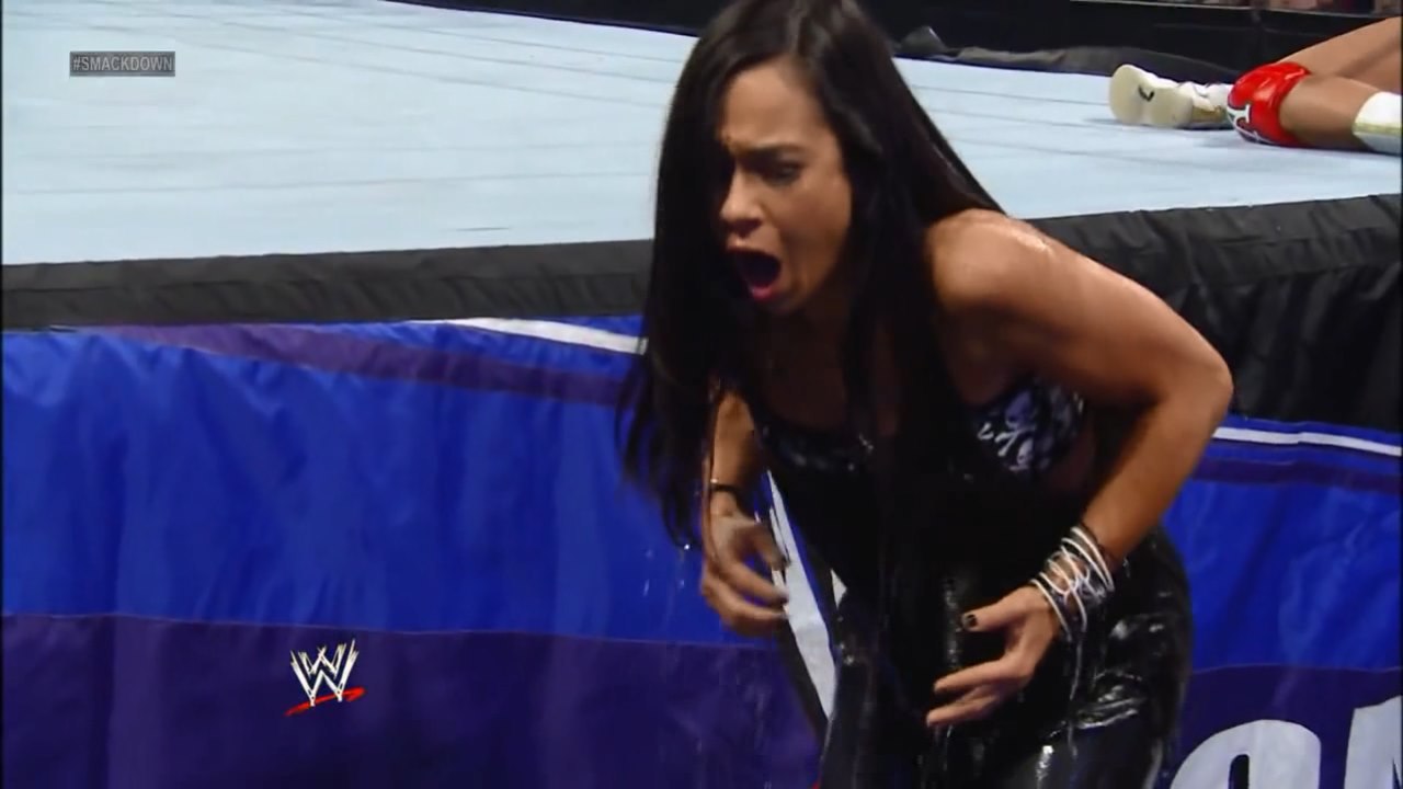 ring side scene-WWE SMACKDOWN 8 March'2013 AJ Brooks as AJ Lee will soaked at the ring-with Big E,black long top(hard end)