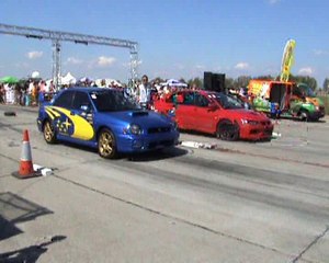 Mitsubishi Lancer EVO IX Vs. Subaru Impreza WRX STI Drag Race