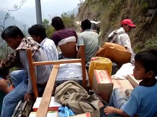 Nepali Riding on top of a bus -danger road nepal