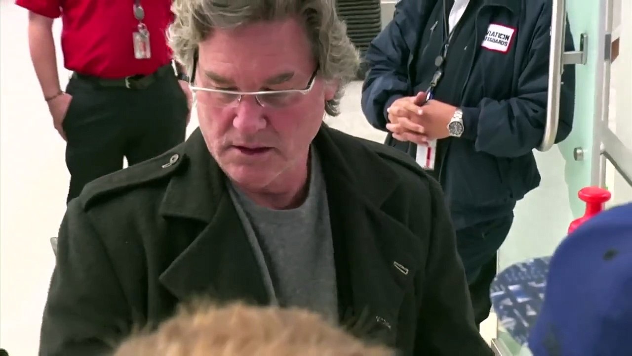Kurt Russell Strolls with Goldie Hawn and wonders why the paparazzi are working on a Sunda