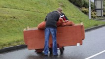 Two Guys move Broken Down Sofa in Northern Ireland