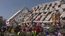 More than 130 people still trapped under debris after Taiwan quake