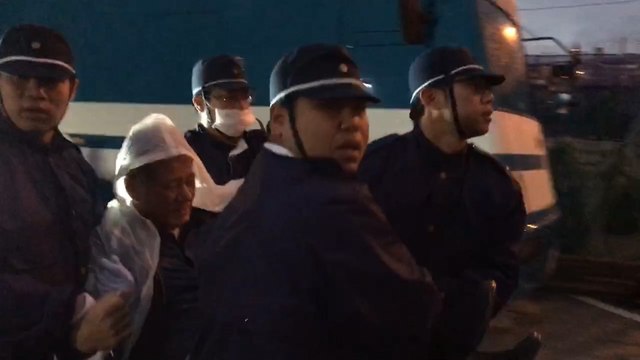 Protesters carried off outside U.S. military base in Okinawa