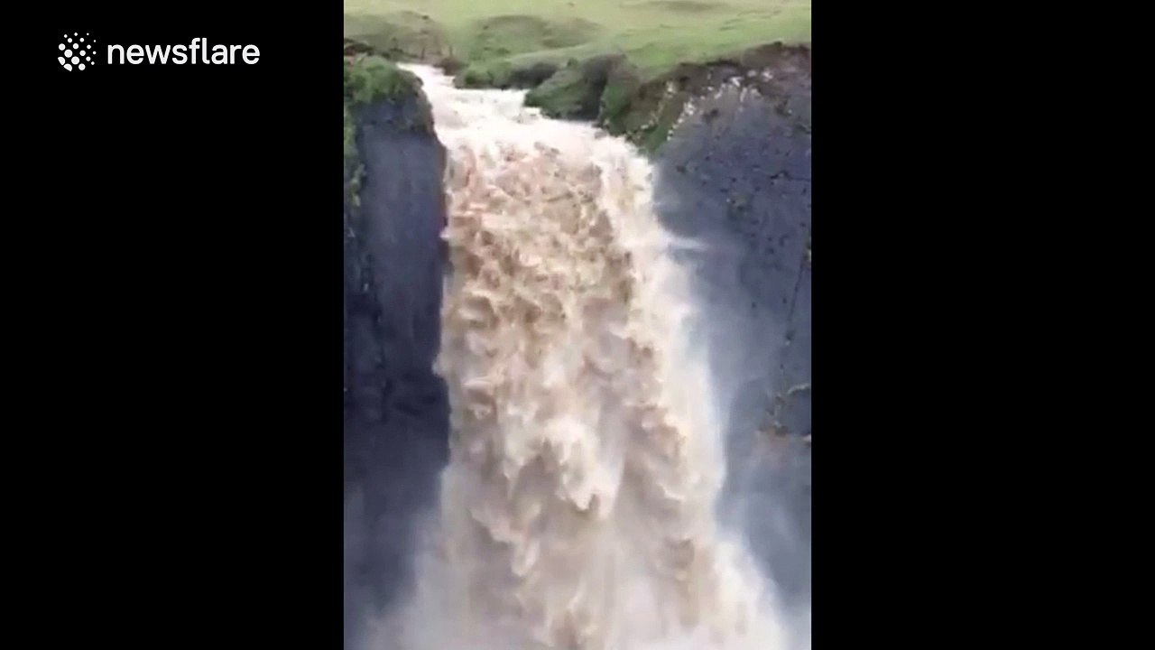 Heavy rain turns Devon waterfall into torrent