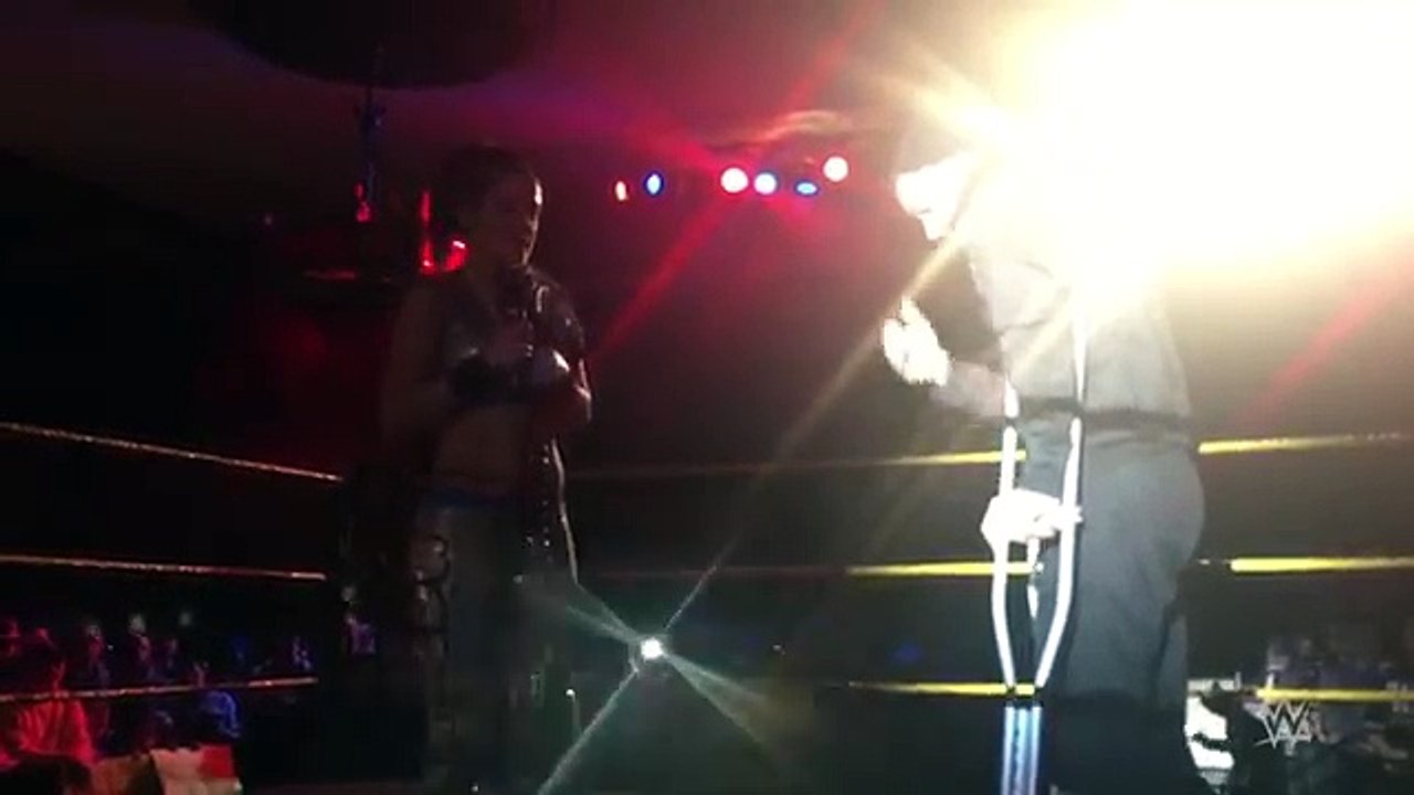 Bayley cheers Finn Bálor up after his injury at NXT Live
