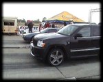 Jeep Grand Cherokee Vs. Mazda RX 7 Turbo Drag Race