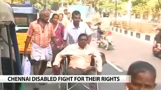 In wheelchairs, crutches, for rights they stand up