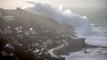Incredible Moment: A giant wave swells up and engulfs an entire Cornish Hillside as 100mph