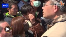 Distraught relatives of Taiwan quake victims wait for news