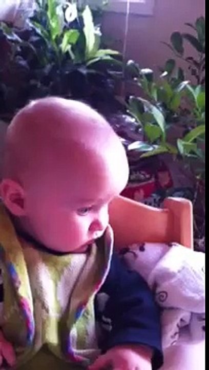 Funny baby eats sweet potato