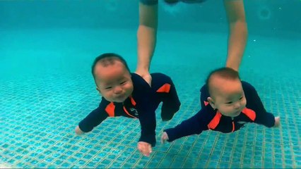 cute twins swimming