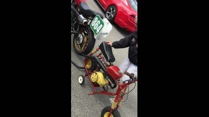 Pull-starting a motorbike at Barber Vintage Festival 2015