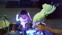 Cockatoo singing and dancing with baby drummer