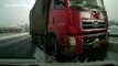 Scooter rider escapes death after falling under truck on icy China road