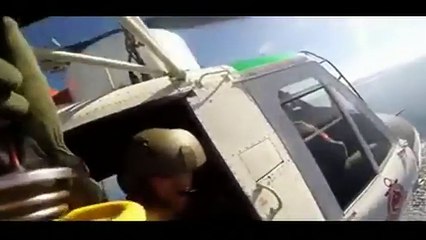 Helmet camera video from the Turkish coastguard showed a migrant being rescued