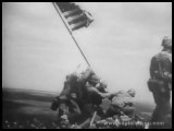 1945 MARINES RAISE THE U.S. FLAG ON IWO JIMA - WWII NEWSREEL