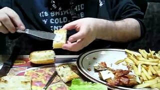 Katsu eats a sandwich