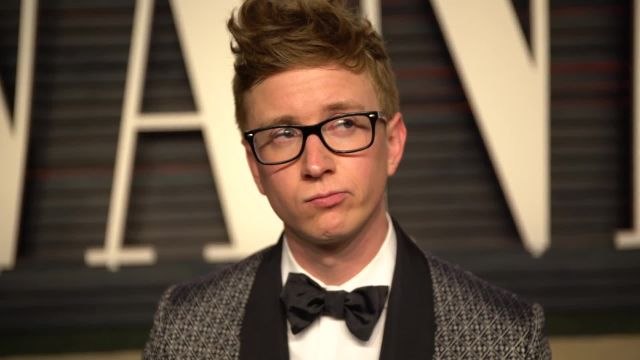 Watch Tyler Oakley Try to Flag Down Leonardo DiCaprio and Lady Gaga on the Oscar Party Red Carpet