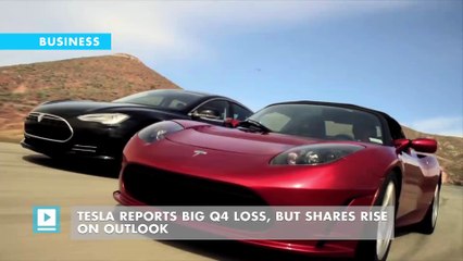 Tesla reports big Q4 loss, but shares rise on outlook